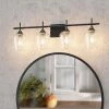 CLAVIE Hanging Bathroom Light Fixtures 4-Light 30 in. W x 9 in. H Wall Sconces with Clear Glass Shade Vanity Light in Black