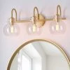 CLAVIE Gold Bathroom Light Fixtures 3-Light 21 in. W x 9 in. H Wall Sconces with Clear Glass Shade Vanity Light in Black